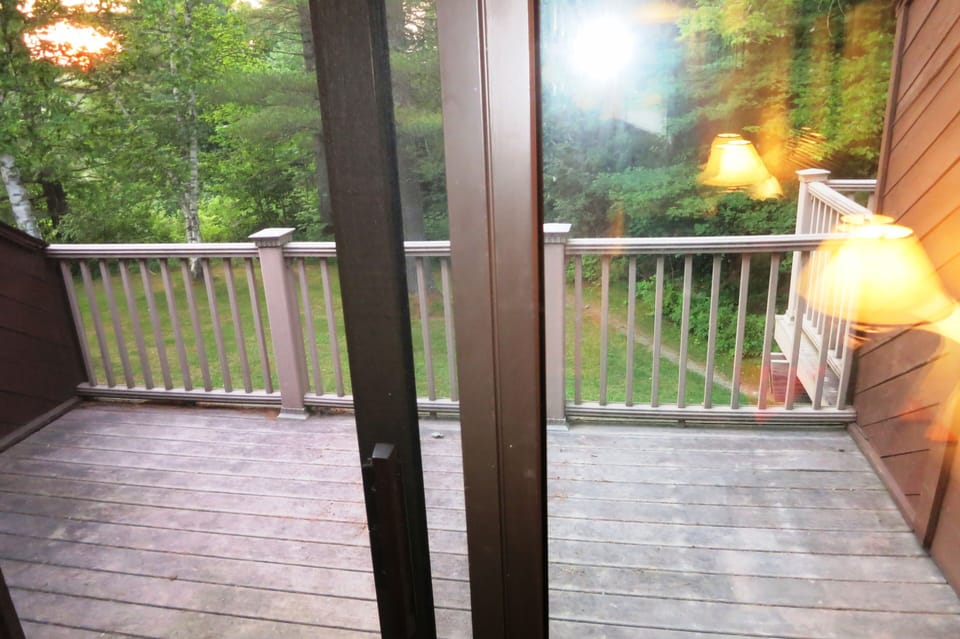 Private deck looks out onto back lawn and a Kingdom Trail connecter path!