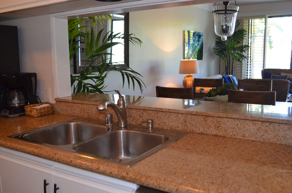 Fully equipped kitchen with granite countertops and new appliances.