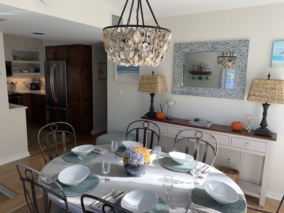 Dining room featuring custom oyster shell chandelier