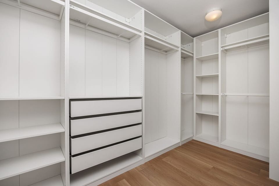 A spacious walk-in closet in the ensuite master bathroom