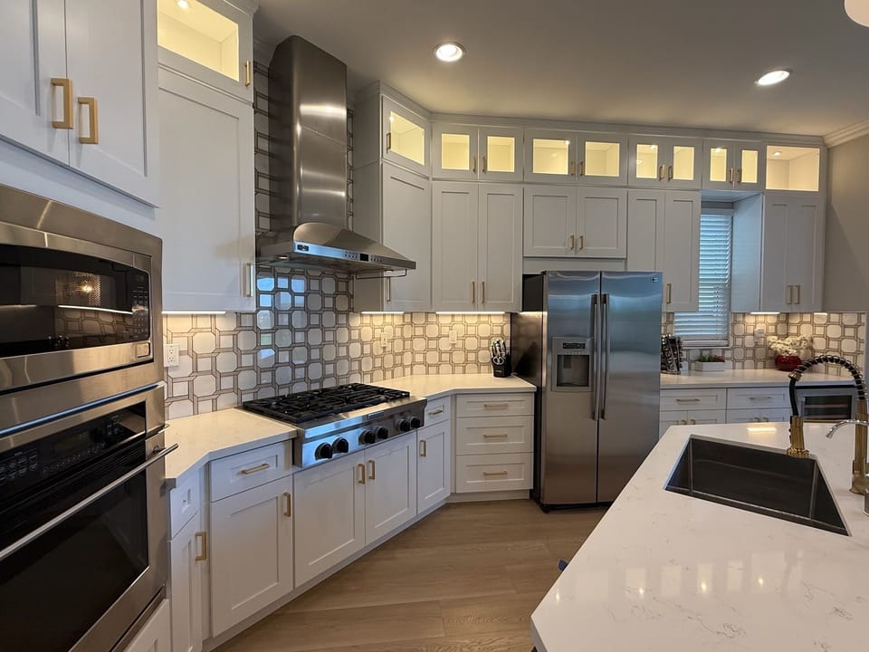 Clean lines & layered lighting; this kitchen is fully equipped to handle it all.