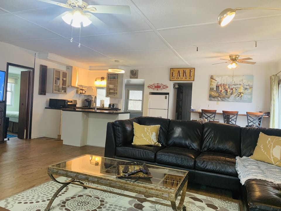 Open concept living room with 2 large sectional sofa