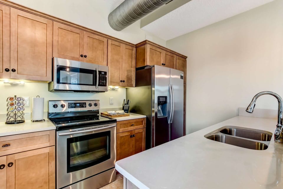Stainless Steel Appliances including refrigerator, stove, oven, microwave, ice maker, filtered water, dishwasher, double sinks