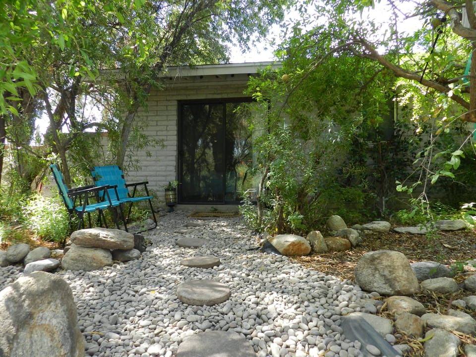 outside entrance , path to pool and patio