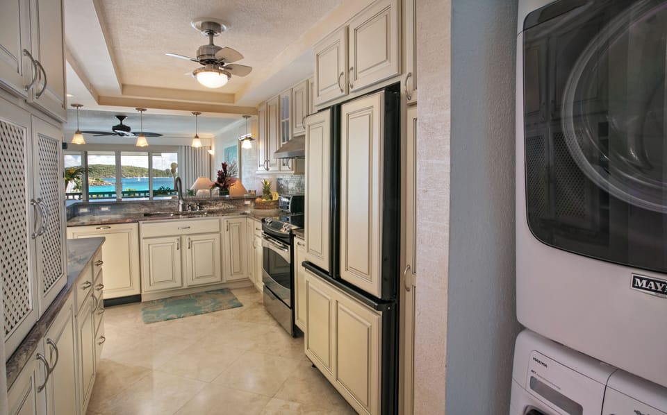 Kitchen with washer and dryer in utility area to make your stay comfortable. 