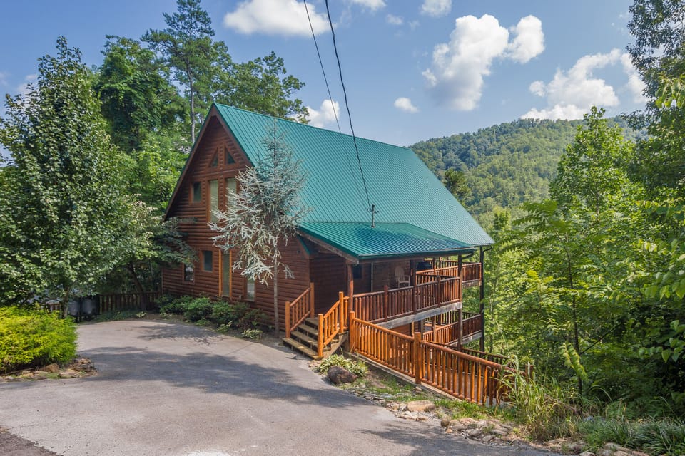 A View Of This Beautiful Cabin With A Half Moon Shaped Driveway For Easy Access!