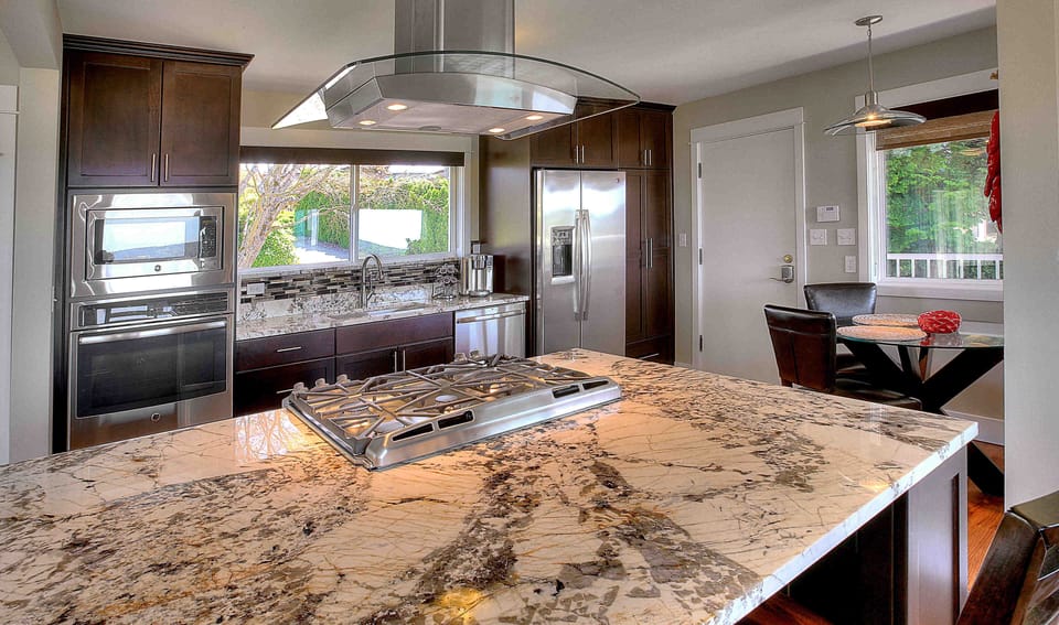 Granite counter tops and high end appliances throughout kitchen 
