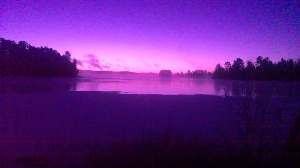 Sunrise on the freezing lake