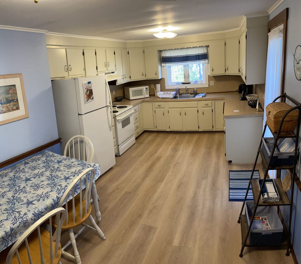 Large eat-in kitchen leads out to back deck