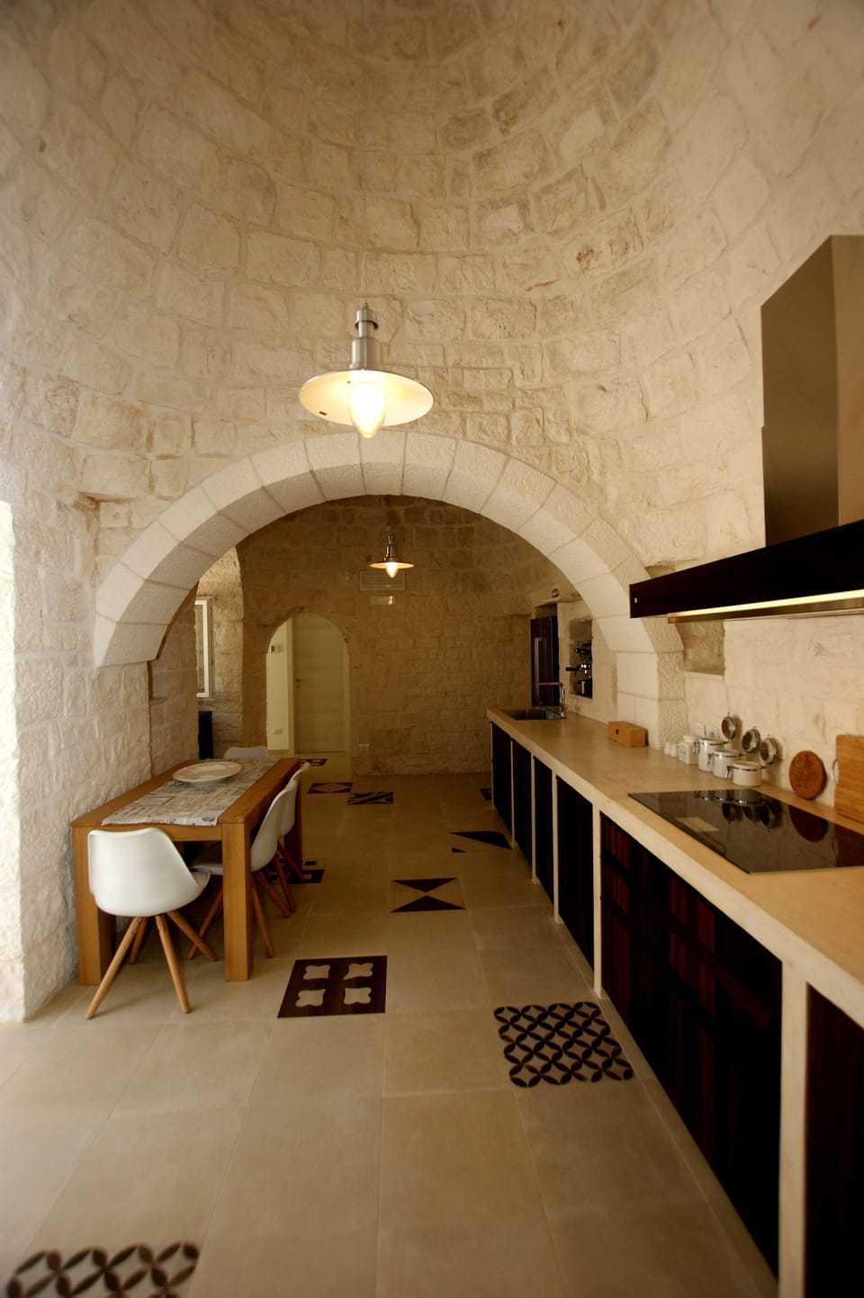Cooking under the high conical roofs of the trullo.
