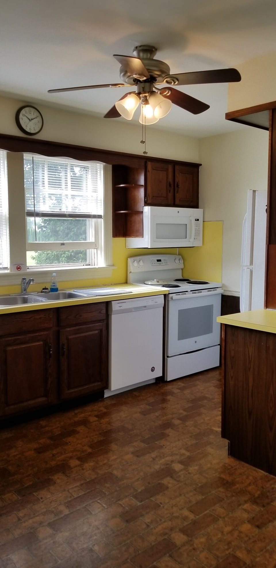 Kitchen with dishwasher, stove, microwave and refrigerator