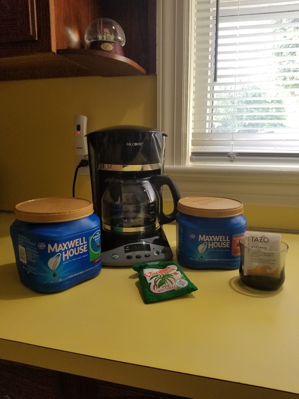 Complimentary Regular & Decaf coffee in refrigerator along with bottled water.