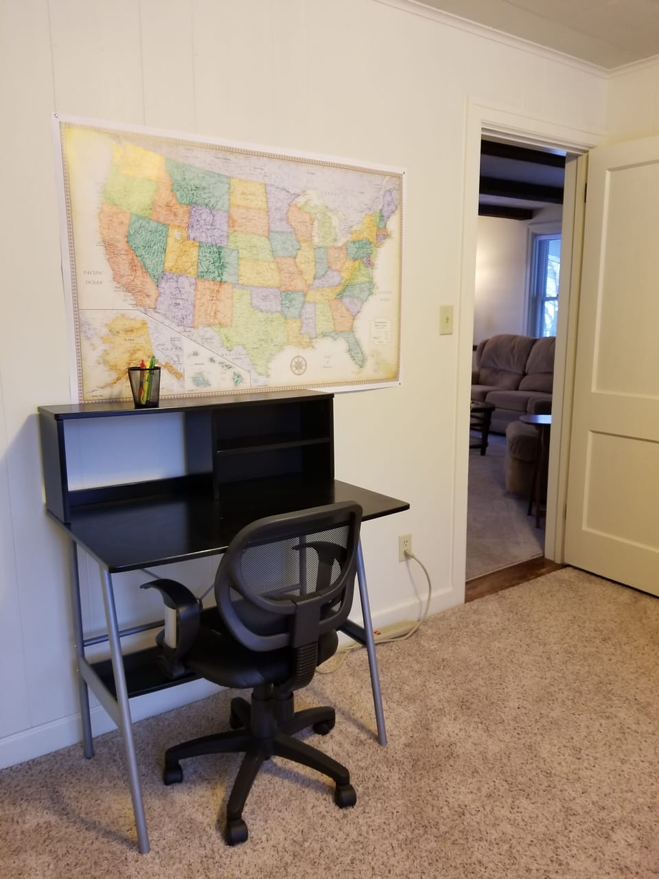Den with desk and daybed in it.  Next to Living Room and bathroom