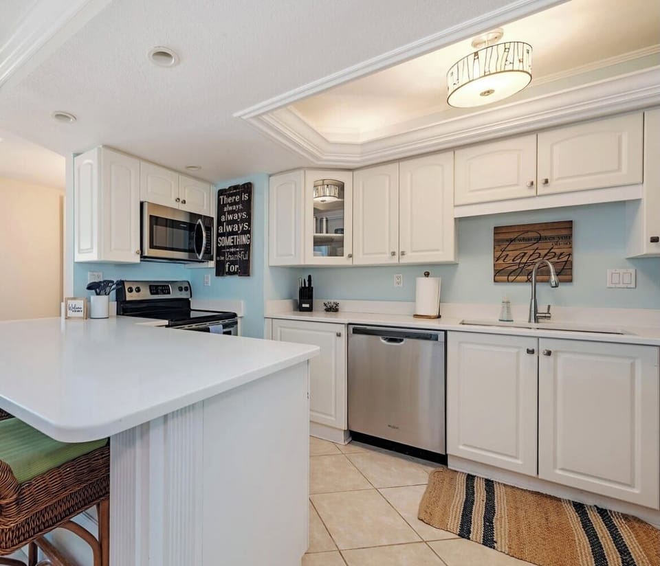 Fully stocked kitchen w quartz counters and ss appliances