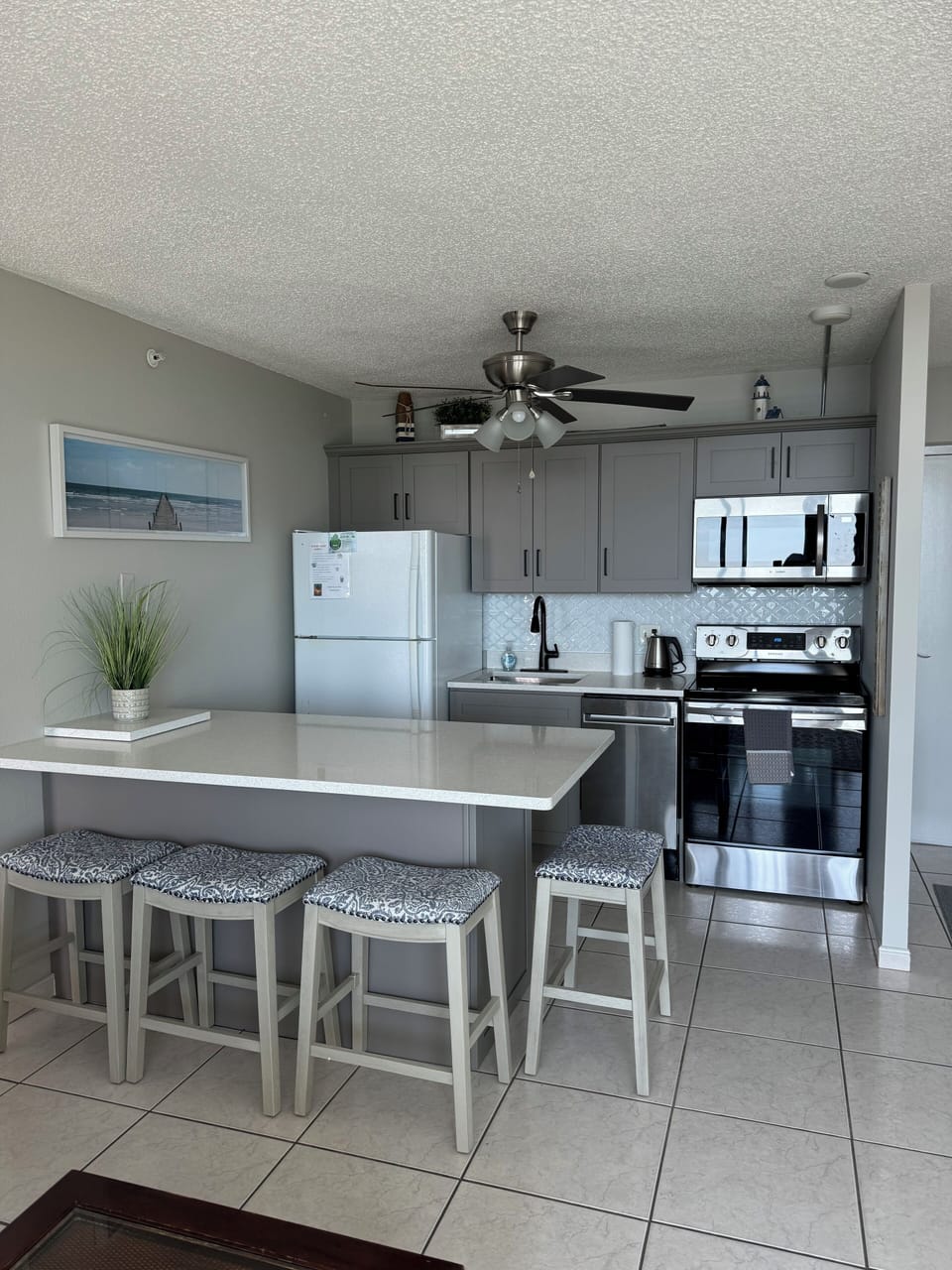 New kitchen in 2024 with updated cabinetry, counters, seating and appliances!