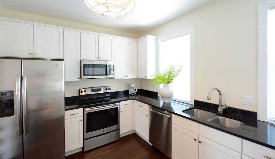 Green House - Kitchen is located off the large living/dining space. 