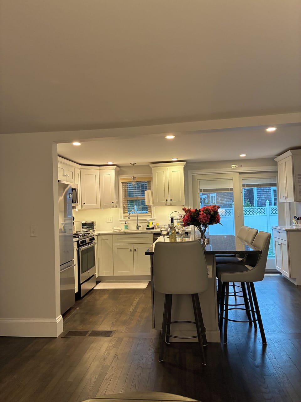 Kitchen with island and fully stocked pots pans, dishes, glass ware, etc 
