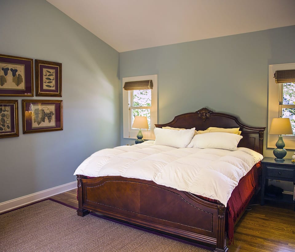 BEDROOM with king size bed under a vaulted ceiling for a restful night.