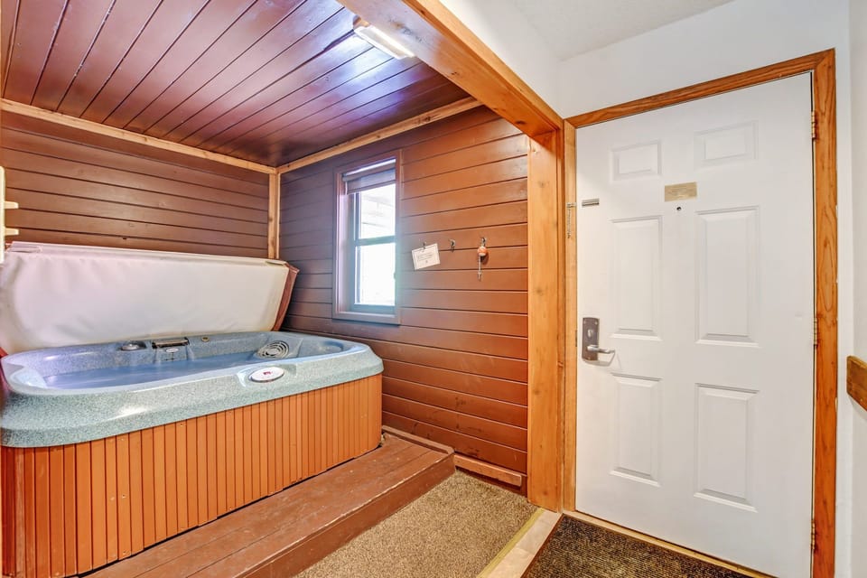 Private indoor hot tub with view of front door