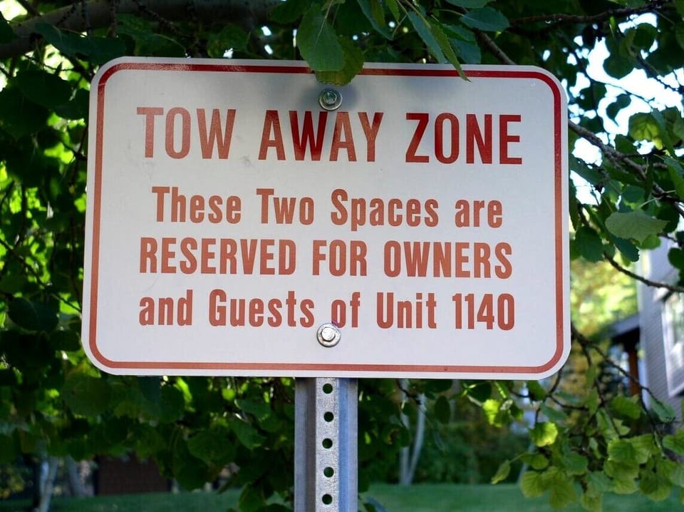 2 assigned parking spaces right outside main door