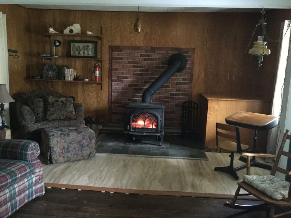 Nothing like a wood stove to warm you up!  leather recliner replaced plaid couch