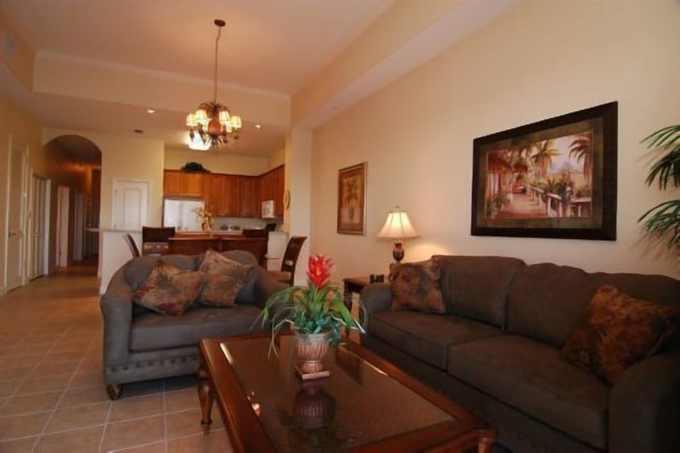 Living room with a queen sized sofa sleeper. • Tile floors 