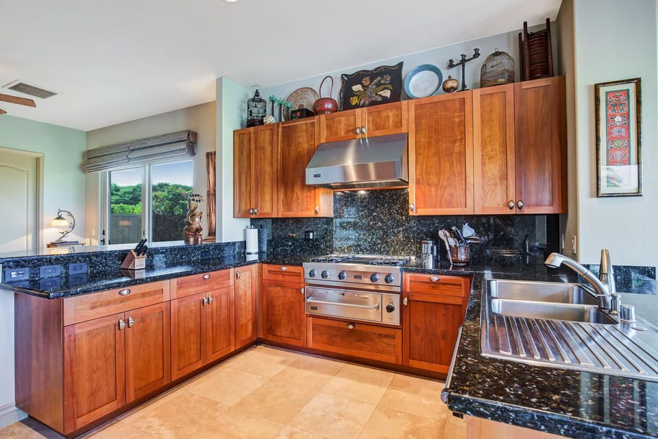 Kitchen featuring Viking appliances, 6-burner gas stove and granite countertops