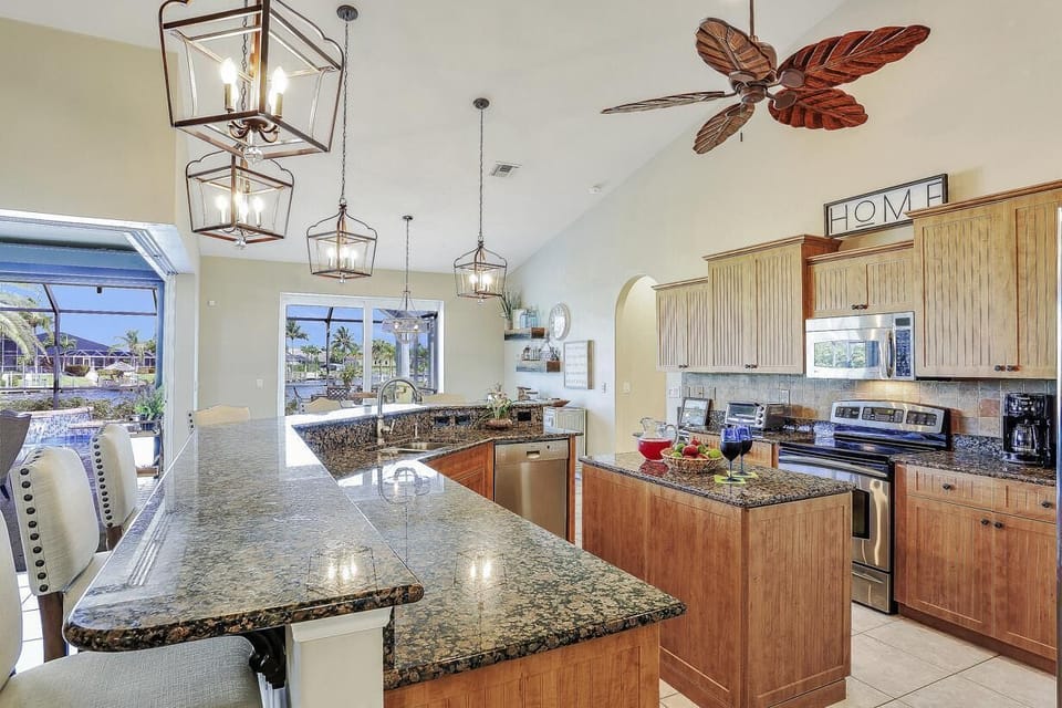 View of the Kitchen with Breakfast Bar seating, granite worktops and island