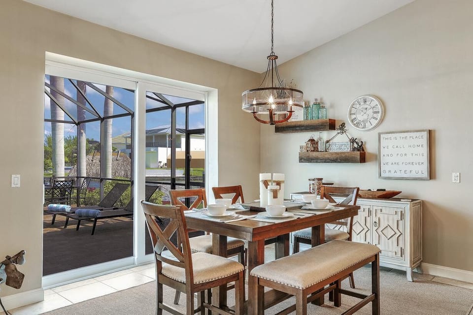 The casual Dining area with views over the Pool, Kitchen and open plan Living Area