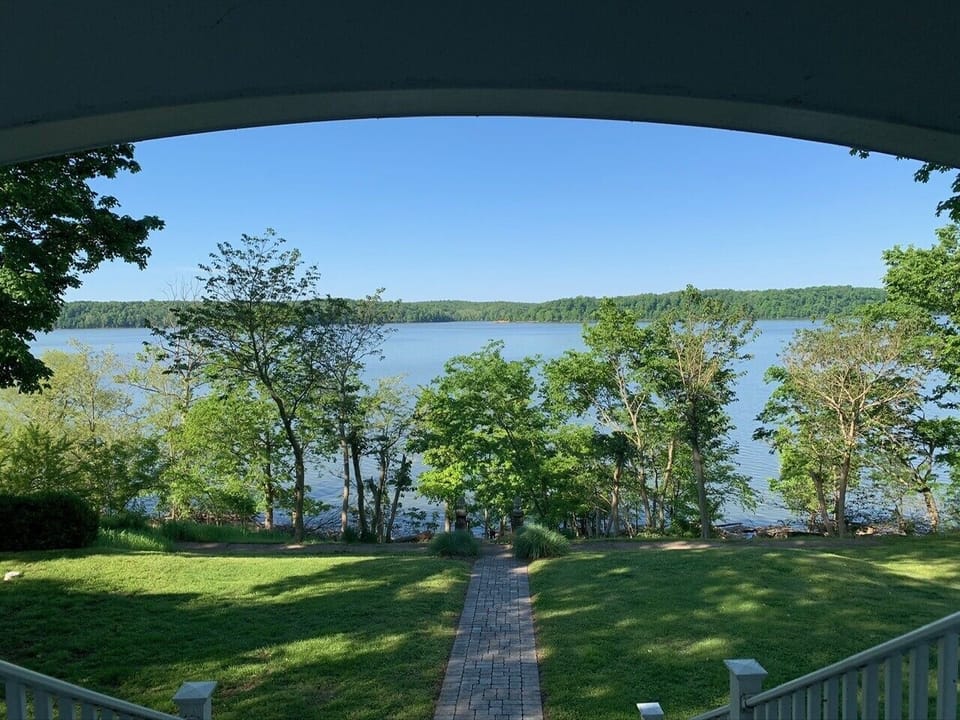 Summer on the wrap around porch...the view is spectacular!!! Tree's in full 
