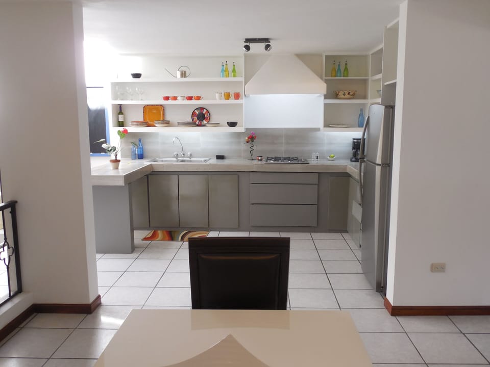 Remodeled kitchen with gas cooktop as seen from Dining Area