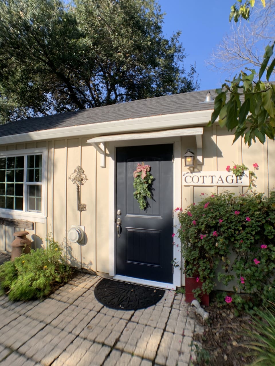 Front door to the Cottage, located behind historic Main Street Farmhouse!