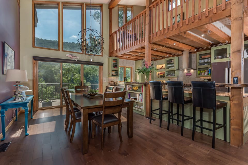 Another view of Dining area and Kitchen overlooking deck and lake