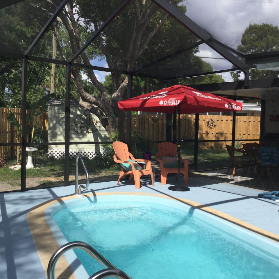 Private back yard with inground splash pool. 