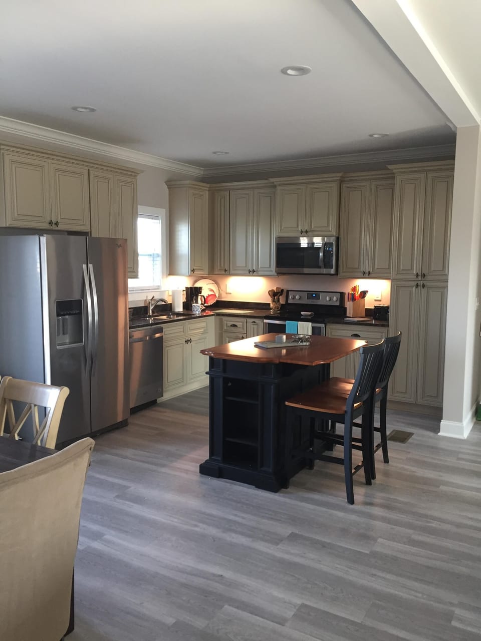 Beautiful modern kitchen is open to living areas for wonderful family time
