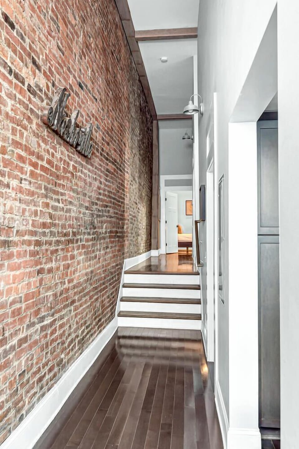 Hallway off the kitchen leading to the bedrooms, bathrooms and laundry room.