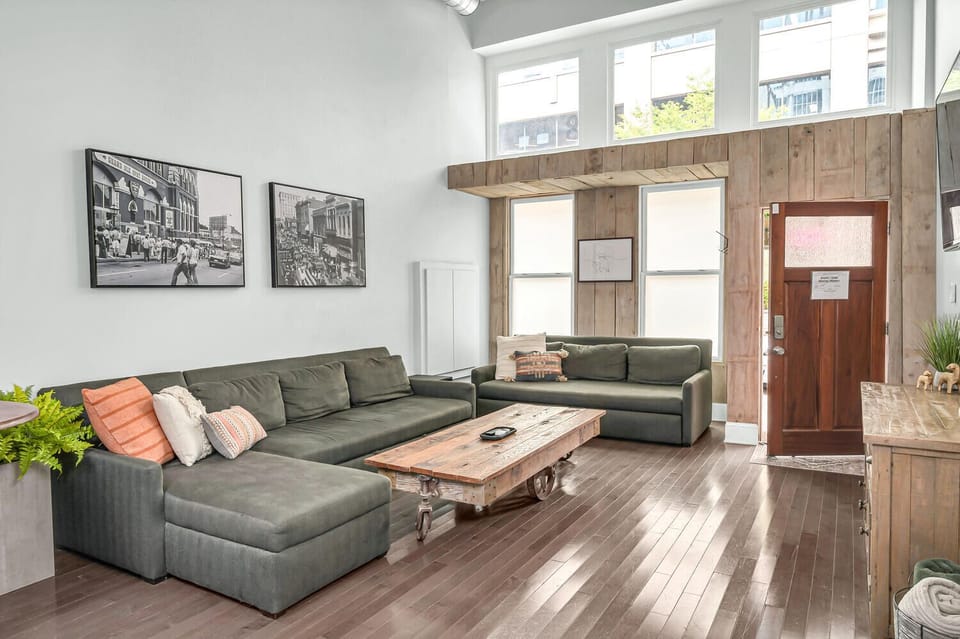 Spacious living room with two luxury queen sleeper sofas to sleep 4 guests