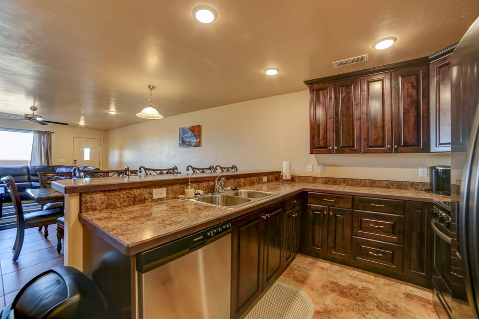 Fully stocked kitchen with dishes and cookware 