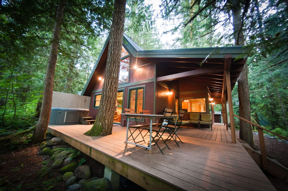 Back Deck w/ Hot Tub, Table & Bbq. Fire pit & Creek at the bottom of the Stairs 