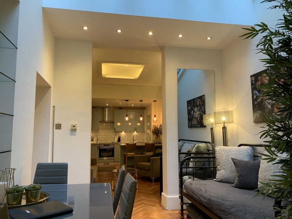 Dining area with convertible daybed/sofa and skylights above
