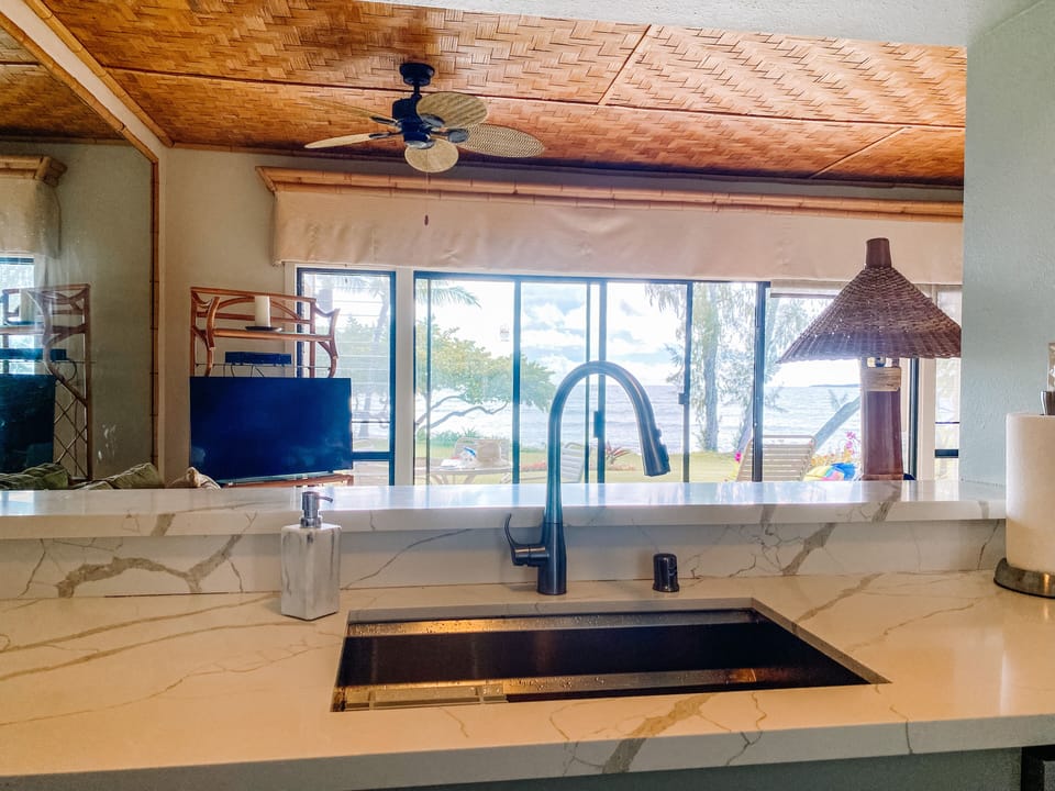 Enjoy a view of the rolling waves while you rinse you plates.