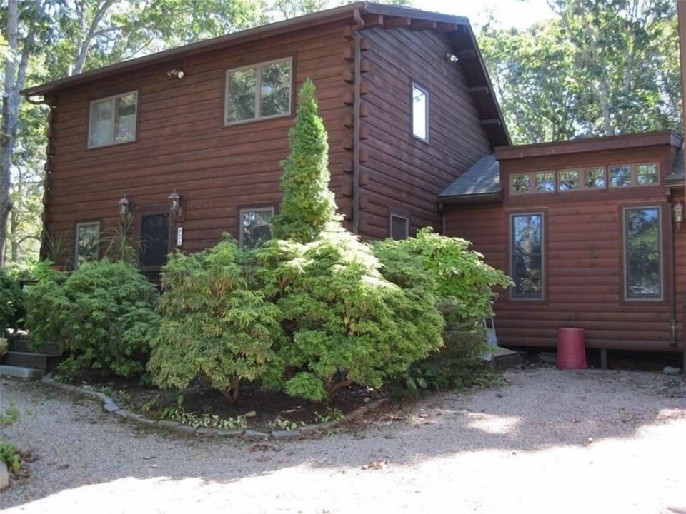 Two story salt box.  Main entrance off front yard.