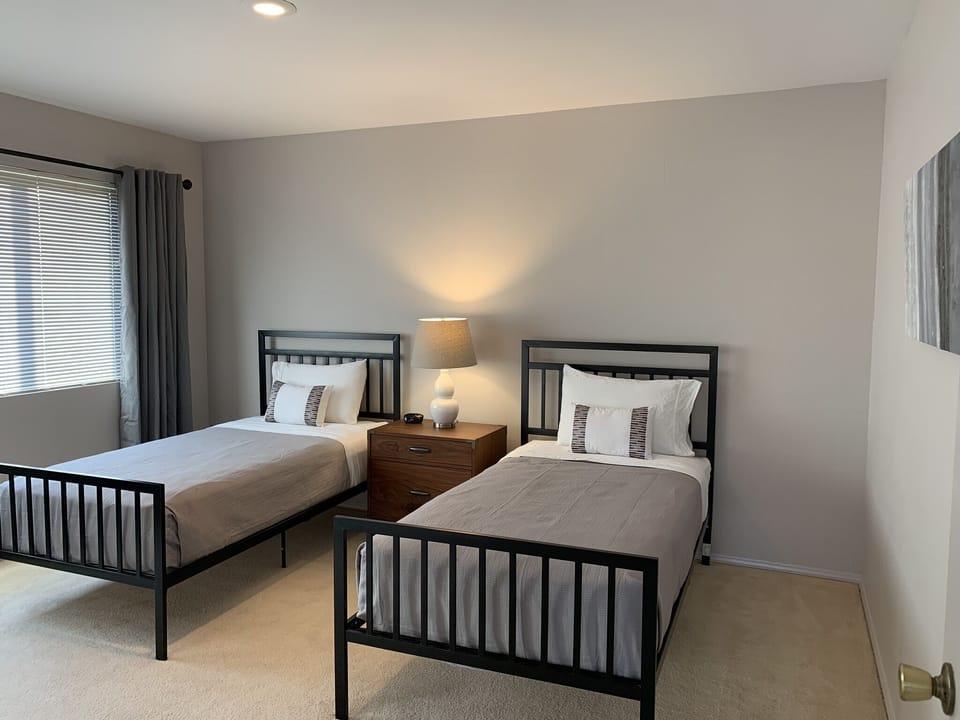 Twin bedroom is spacious and comfortable but has no TV