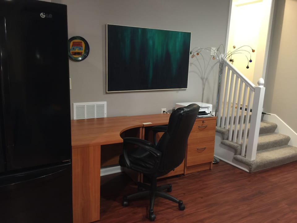 desk area with wireless printer.  