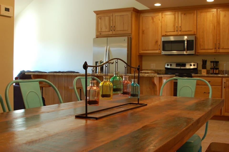 Dining table and kitchen give you a great indoor place to eat - fits 8 easily