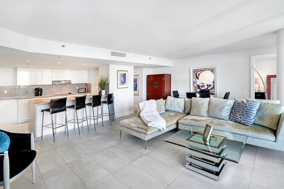 Living room, dining area, seating at counter, Roku tv, balcony access