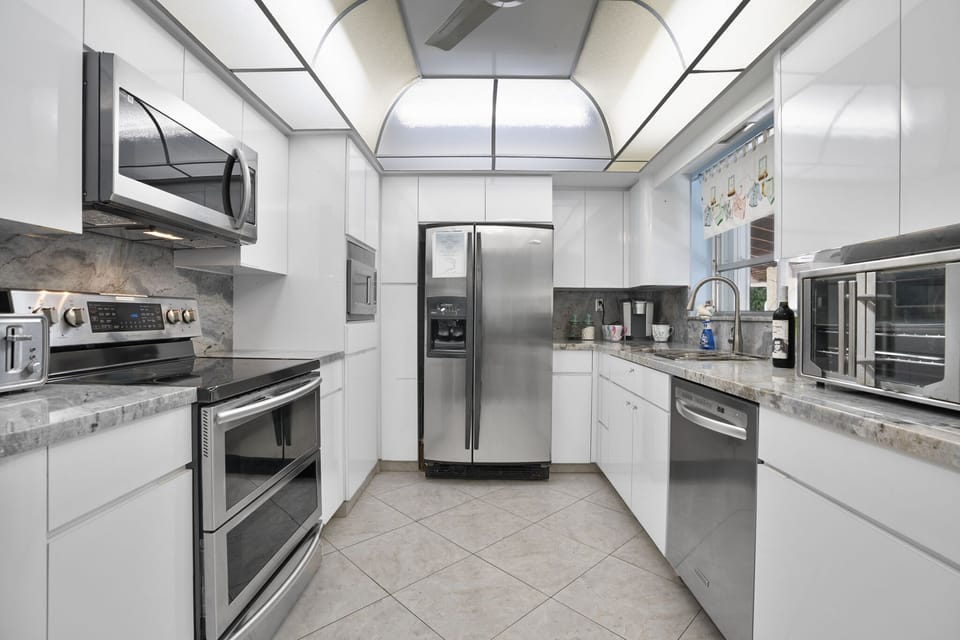 Eat-in kitchen connects directly to the patio and the laundry room. 