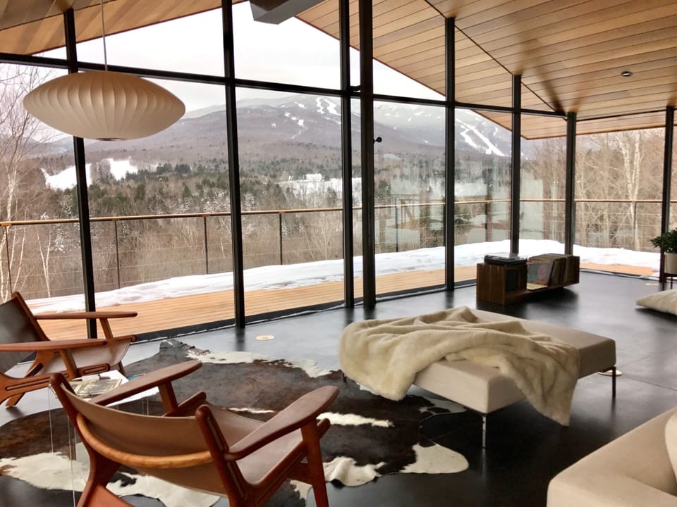 Winter scene of the living room looking to the Mt. Mansfield ski slopes.