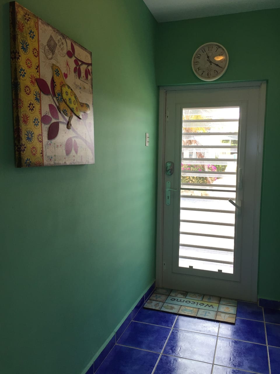 Louvered door with keyless entry