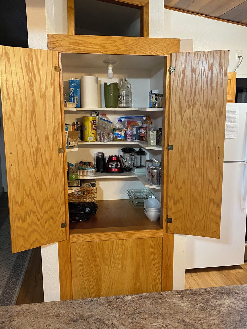 Kitchen pantry with extra appliances, serving dishes, etc.